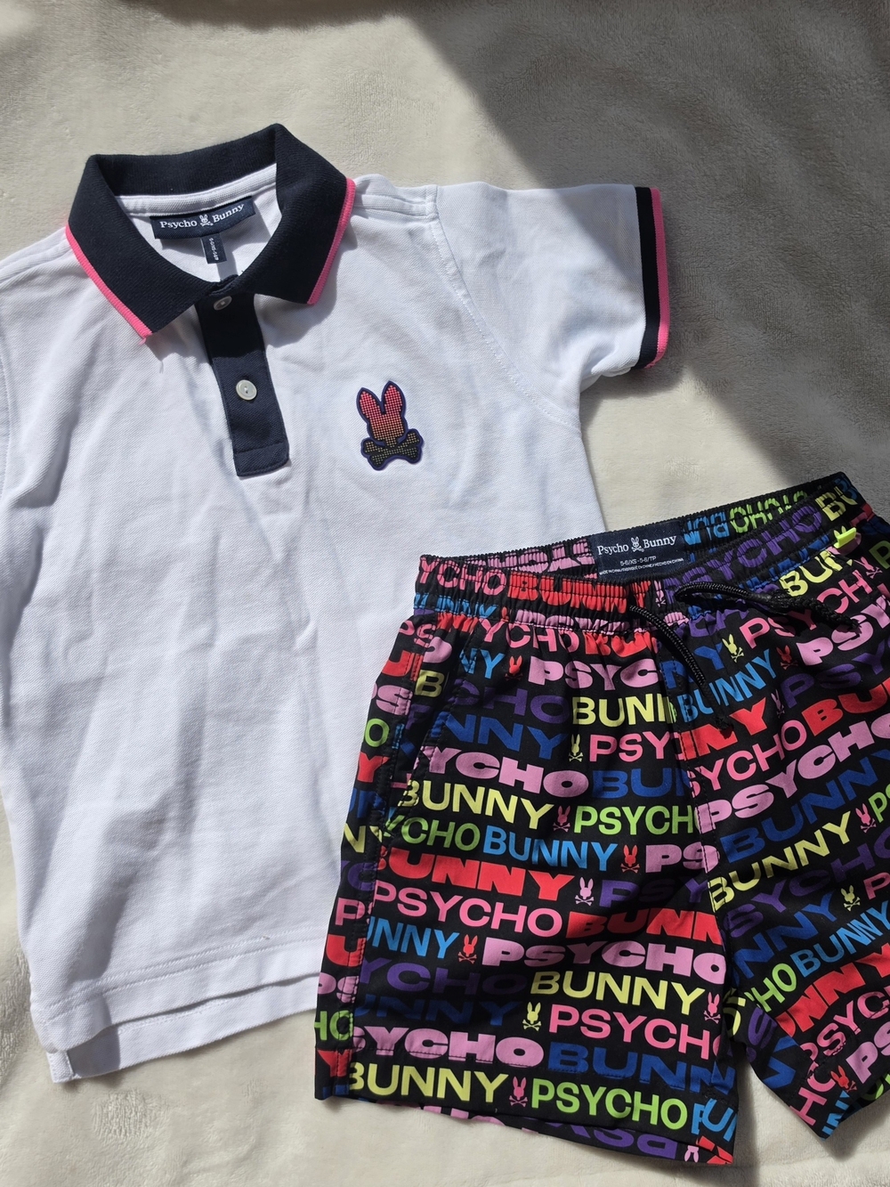Psycho Bunny White Polo with Navy Collar & Pink Trim